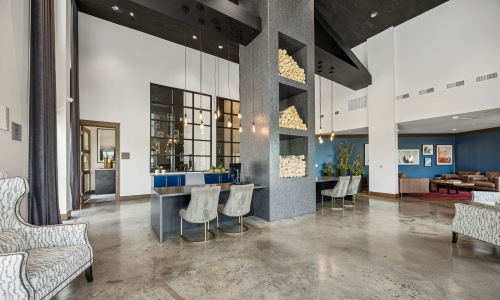 a clubroom with tables and chairs