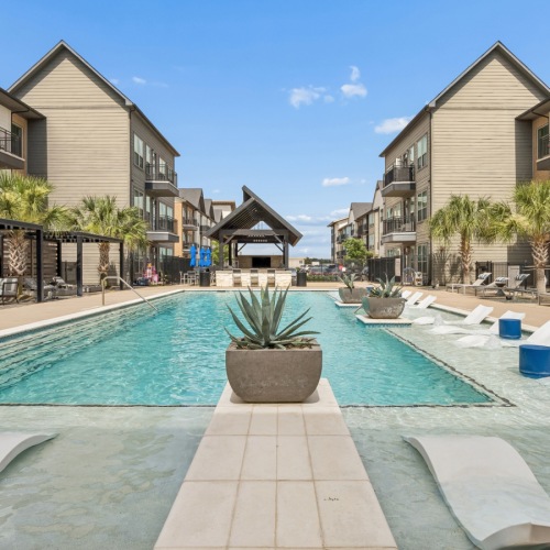 a swimming pool in a large courtyard
