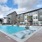 a pool in a courtyard with buildings around it