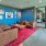 a living room with a red rug