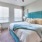 a bedroom with a bed and a fan