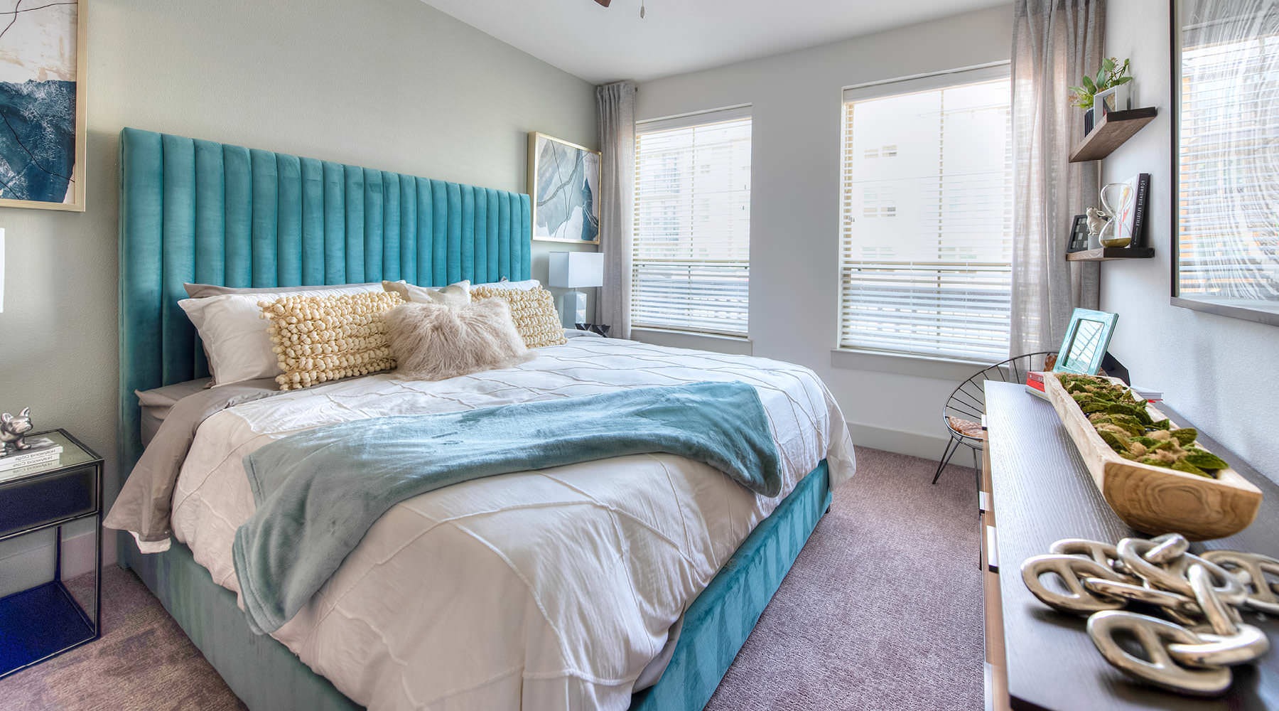 a bedroom with a bed and a fan